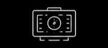 White outlined camera with a circular lens and rectangular body on a black background, resembling a simple digital camera icon.